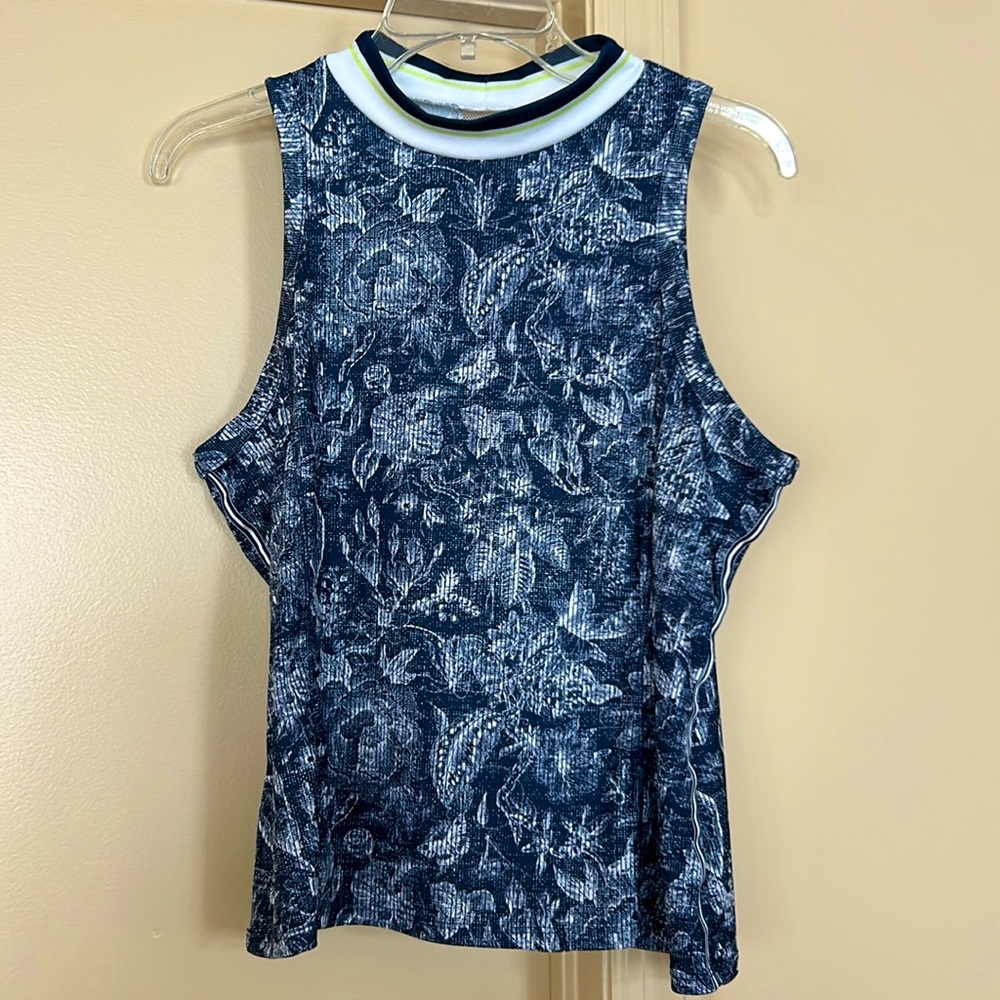 Women’s sleeveless golf/sports shirt. Lightweight fabric, very stretch-able.